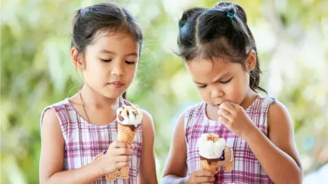 Getty Images Identical twins eating ice cream