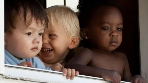 Getty Images Children at a window in Maryland
