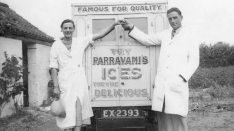 Parravanis Black and white photo of man and woman with ice cream van