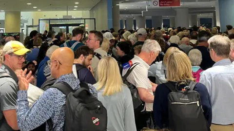 James Devine Passengers keep arriving at the World Central airport