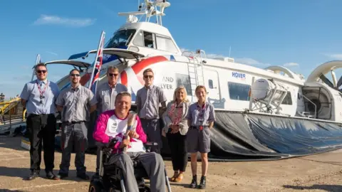 Getty Images Geoff Holt MBE takes the baton over to the Isle of Wight