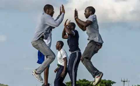 Getty Images Young men jumping in the air, doing exercises in Bulawayo, Zimbabwe - Sunday 27 January 2019