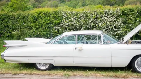 Vanessa Perri-Khoo Cadillac broken down at roadside