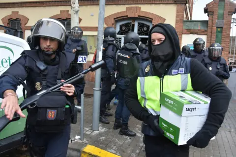 Getty Images ... and ballot papers are seized by police too