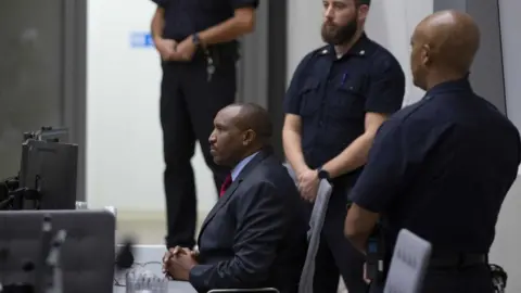 Getty Images Ntaganda listened while the judge read a list of atrocities