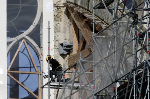 Getty Images Workers are seen restoring the Notre-Dame cathedral