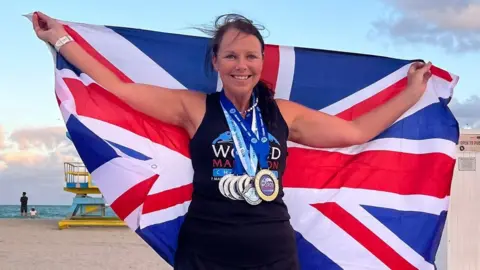 Sally Orange Sally Orange with GB flag and seven medals