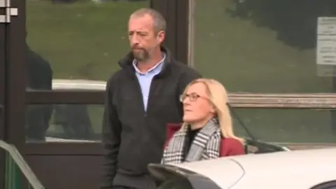 Mr and Mrs Larmour outside the inquest