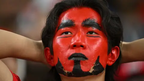 Getty Images A disappointed South Korea fan