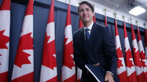 Reuters Justin trudeau leaves news conference