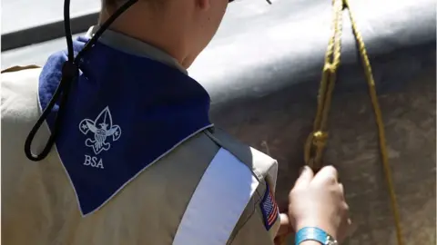 Getty Images A Boy Scout works on a canoe at camp Maple Dell on July 31, 2015 outside Payson, Utah