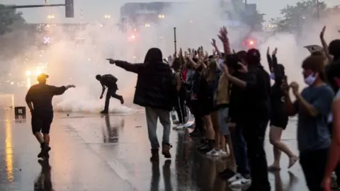 Getty Images Tear gas fired in Minneapolis