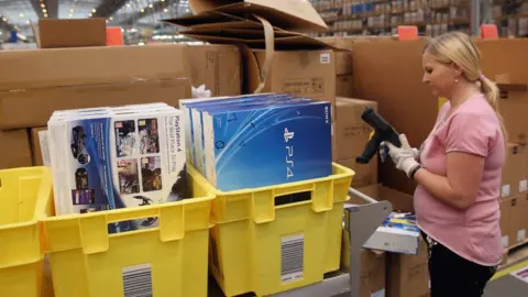 Getty Images Worker at an Amazon warehouse in Peterborough