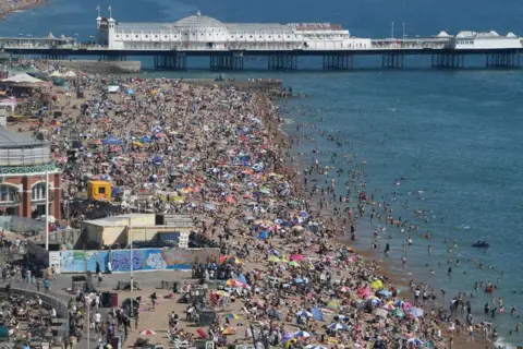 Mike Hewitt/Getty Images Brighton beach is packed as the South of England basks in a summer heatwave on 7 August 2020.