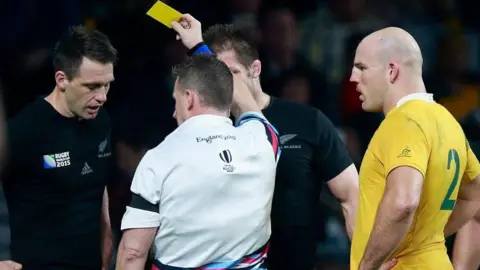 Getty Images Nigel shows the yellow card to Ben Smith of New Zealand during the 2015 Rugby World Cup final