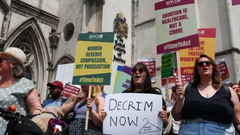 Reuters Pro-choice protesters outside the Royal Courts of Justice in June 2023