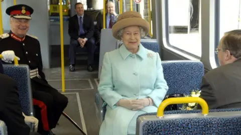 PA Media Queen Elizabeth II rides on the new Sunderland to Newcastle Metro Link after officially opening it at the Park Lane interchange, Sunderland.