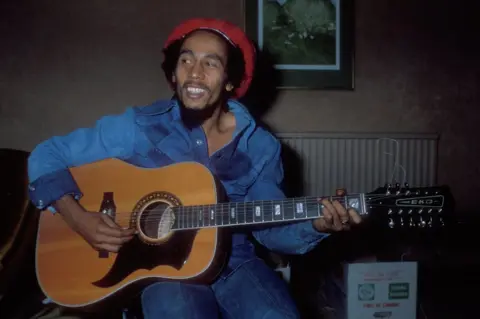 Getty Images Bob Marley plays at a hotel in London in 1978