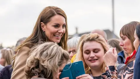 PA Media The Princess of Wales with members of the public as she arrives for a visit to The Street, in Scarborough