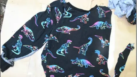 South Wales Police A dinosaur pyjama top recovered at the scene