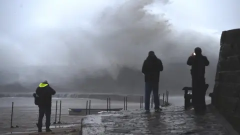 Getty Images Waves hitting the Cobb in Lyme Regis