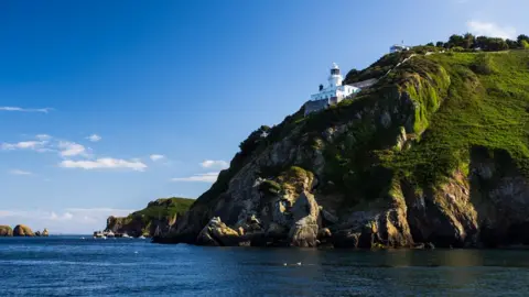 Getty Images/Riccardo Chiades Sark Lighthouse viewed from the sea