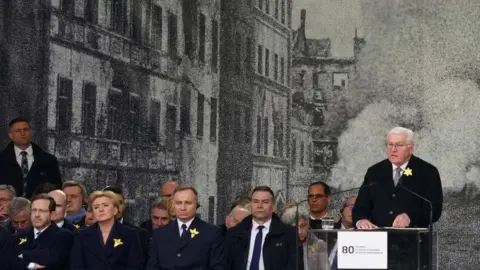 AFP via Getty Images German President Frank-Walter Steinmeier (right) speaks in Warsaw, as Polish President Andrzei Duda (3rd right, front row) and Israeli President Isaac Herzog (1st left, front row) listen