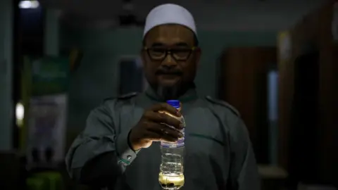 JOSHUA PAUL FOR THE BBC Ustaz Zaki