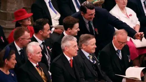 Reuters A guest takes a selfie with Ant and Dec in Westminster Abbey