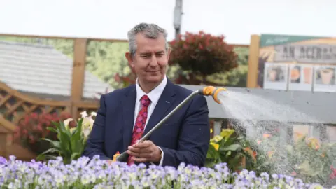 Pacemaker Edwin Poots visiting a garden centre