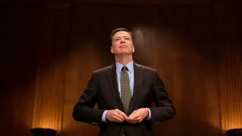 Getty Images James Comey prepares to testify before a Senate committee.