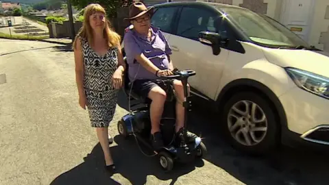 Derek Cummings on mobility scooter