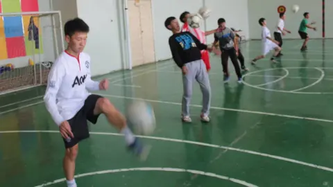 Paul Watson Ochiroo (in white Manchester United shirt) during a full session at the school gym where he trained alone