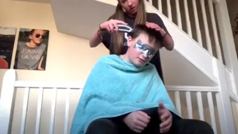 Sam Price A still from Sam Price's video of his sister Bex cutting his hair