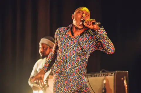 Getty Images Seun Kuti performs on stage during Villanos Del Jazz music festival at Teatro Pavón on November 07, 2022 in Madrid, Spain.