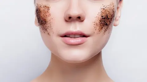 Getty Images A woman's face with face scrub on