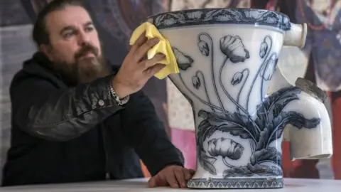 PA Media John Lennon's toilet