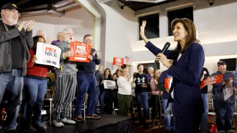 Getty Images Republican presidential candidate former UN Ambassador Nikki Haley waves as she arrives to a campaign event at the Olympic Theater on January 11, 2024 in Cedar Rapids, Iowa