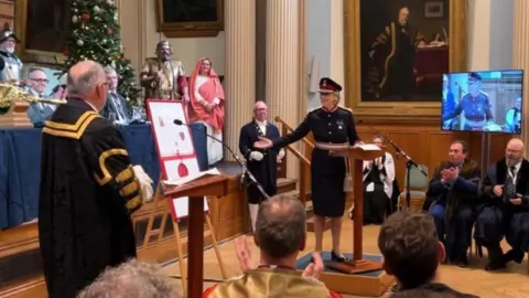 Stuart Woodward/BBC His Majesty's Lord Lieutenant of Essex, Jennifer Tolhurst, presenting the letters patent to Colchester's mayor