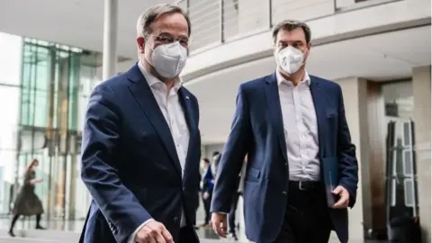 EPA Armin Laschet and Markus Söder appeared together after party talks in Berlin (11 April 2021)