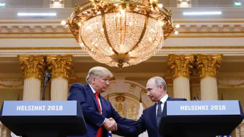 Reuters U.S. President Donald Trump and Russia"s President Vladimir Putin shake hands during a joint news conference after their meeting in Helsinki, Finland, July 16, 2018