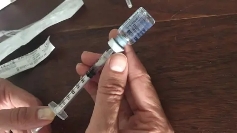 Sophie Sulehria loading a needle