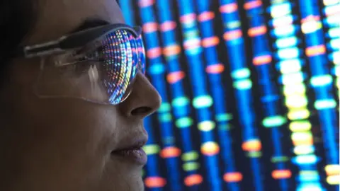 Getty Images Scientist looking at genetic code