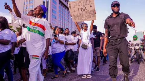 BBC/Adekola Olawale MohBad fans going to a memorial concert in Lagos, Nigeria - Thursday 21 September 2023