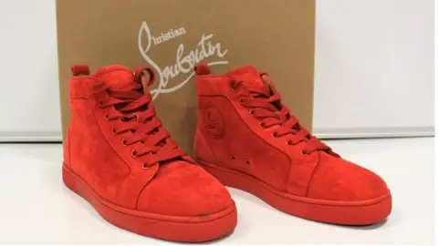 Wilsons Auctions A pair of red shoes