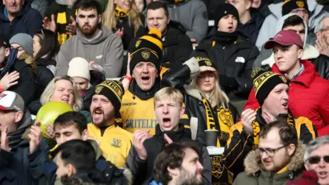 Getty Images Maidstone fans during their third round FA Cup match against Stevenage