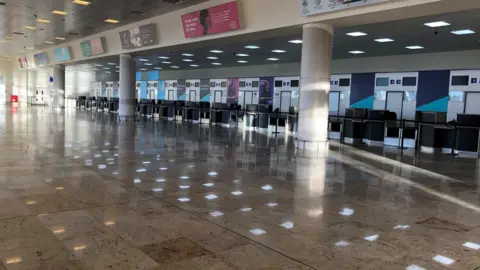 The empty arrivals hall