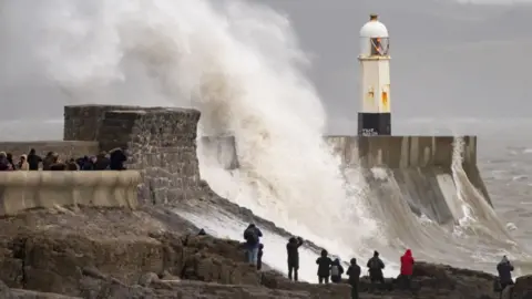 Getty Images Large waves hit the sea wall at Porthcawl, Bridgend county, as Storm Isha lashed the country