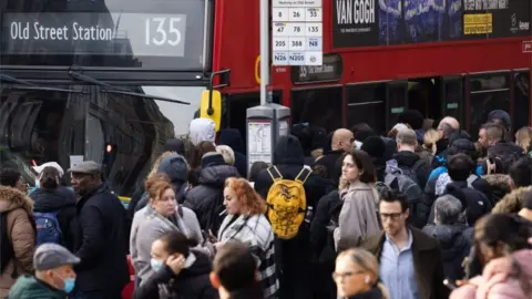 PA Media Buses packed at Liverpool St