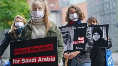 Getty Images Supporters of Reporters Without Borders hold protest outside Saudi Arabian embassy in Berlin (02/10/20)